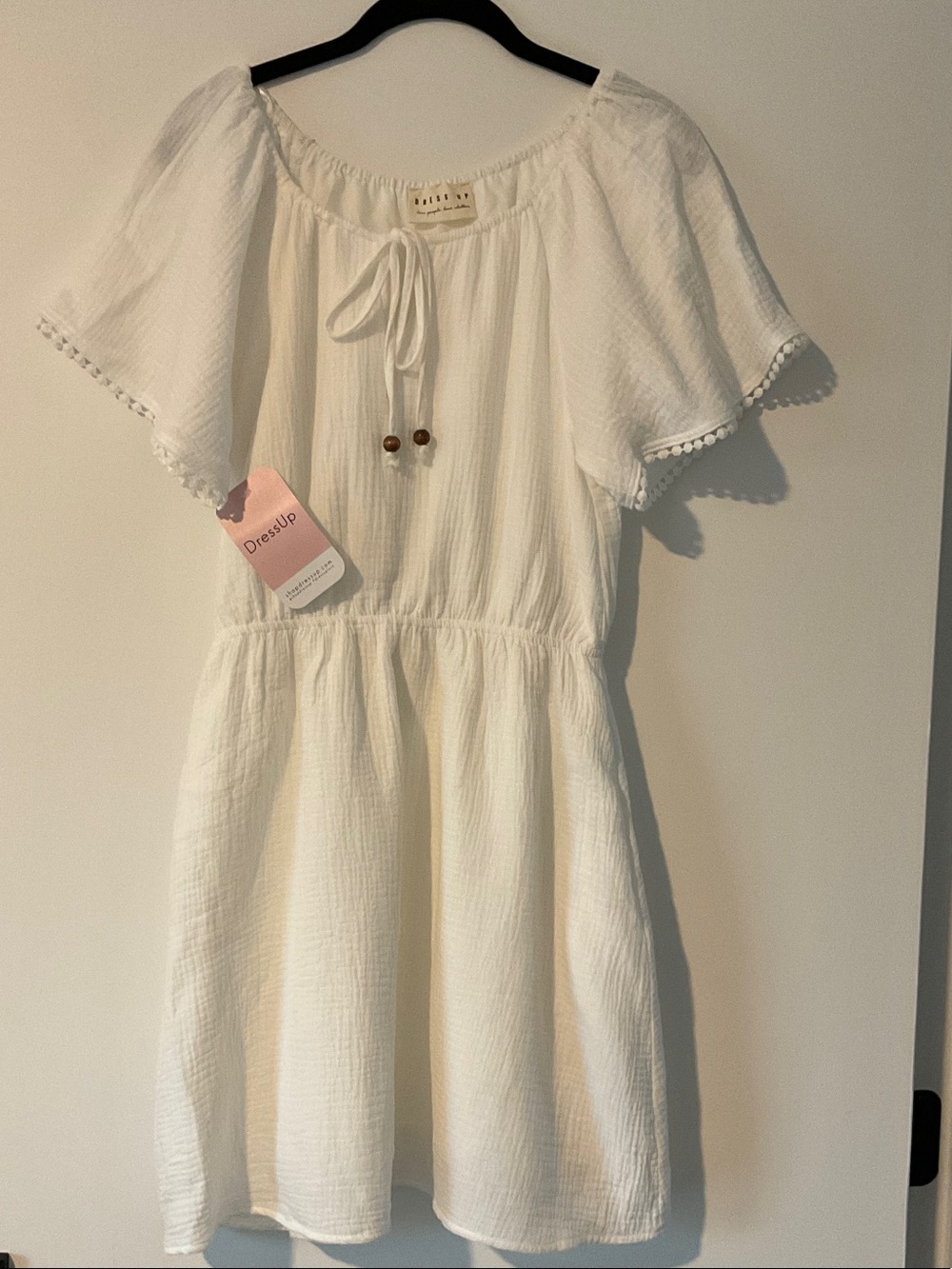 White Tie-Neck Dress with Pom-Trim and Flutter Sleeves